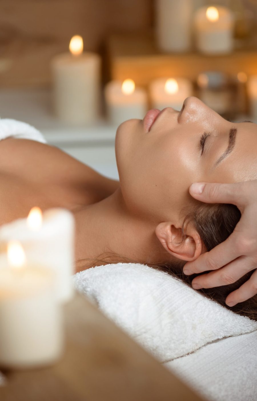 young-woman-having-face-massage-relaxing-spa-salon-scaled.jpg